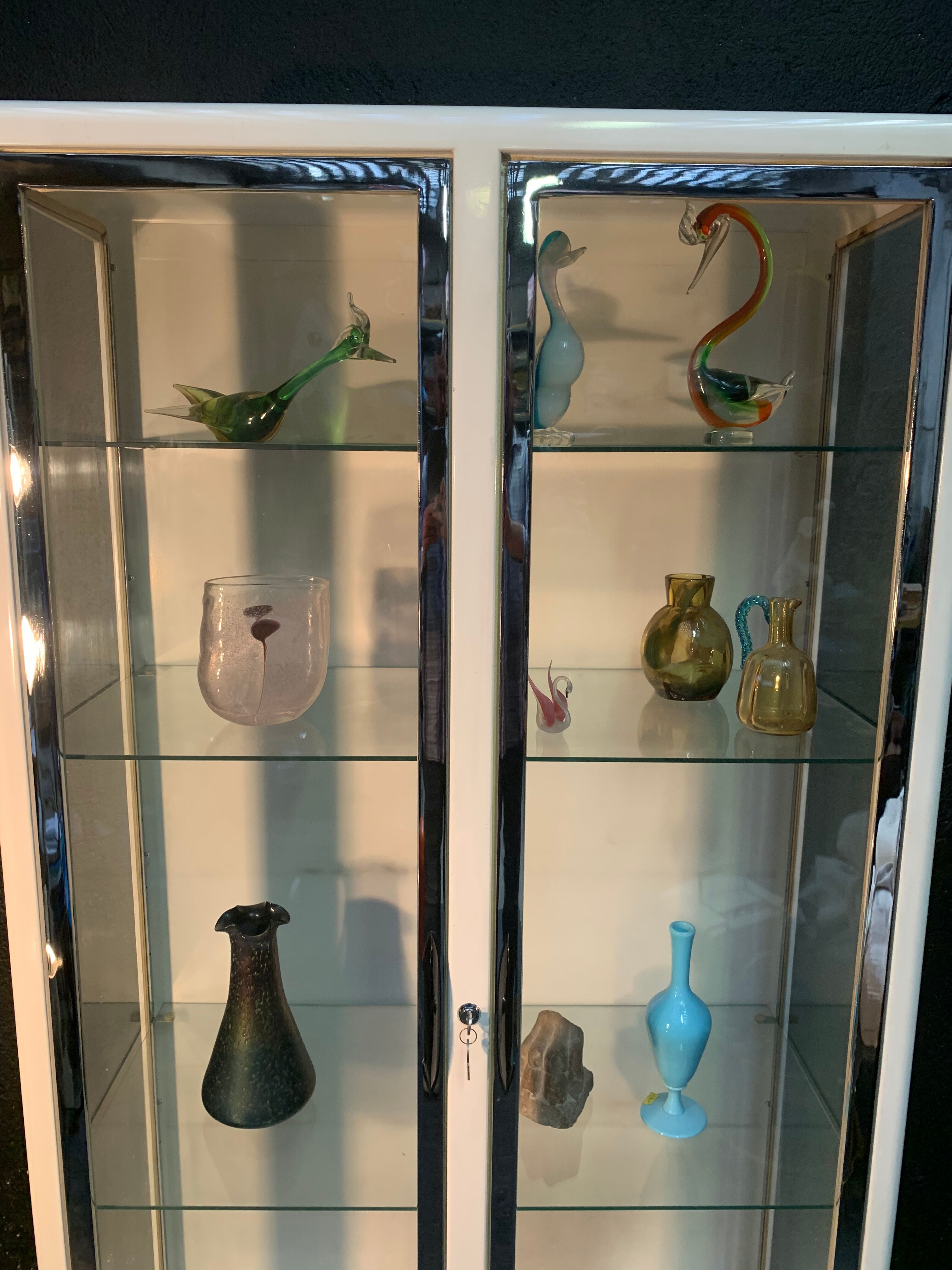 White enamelled metal design showcase. Period 1960