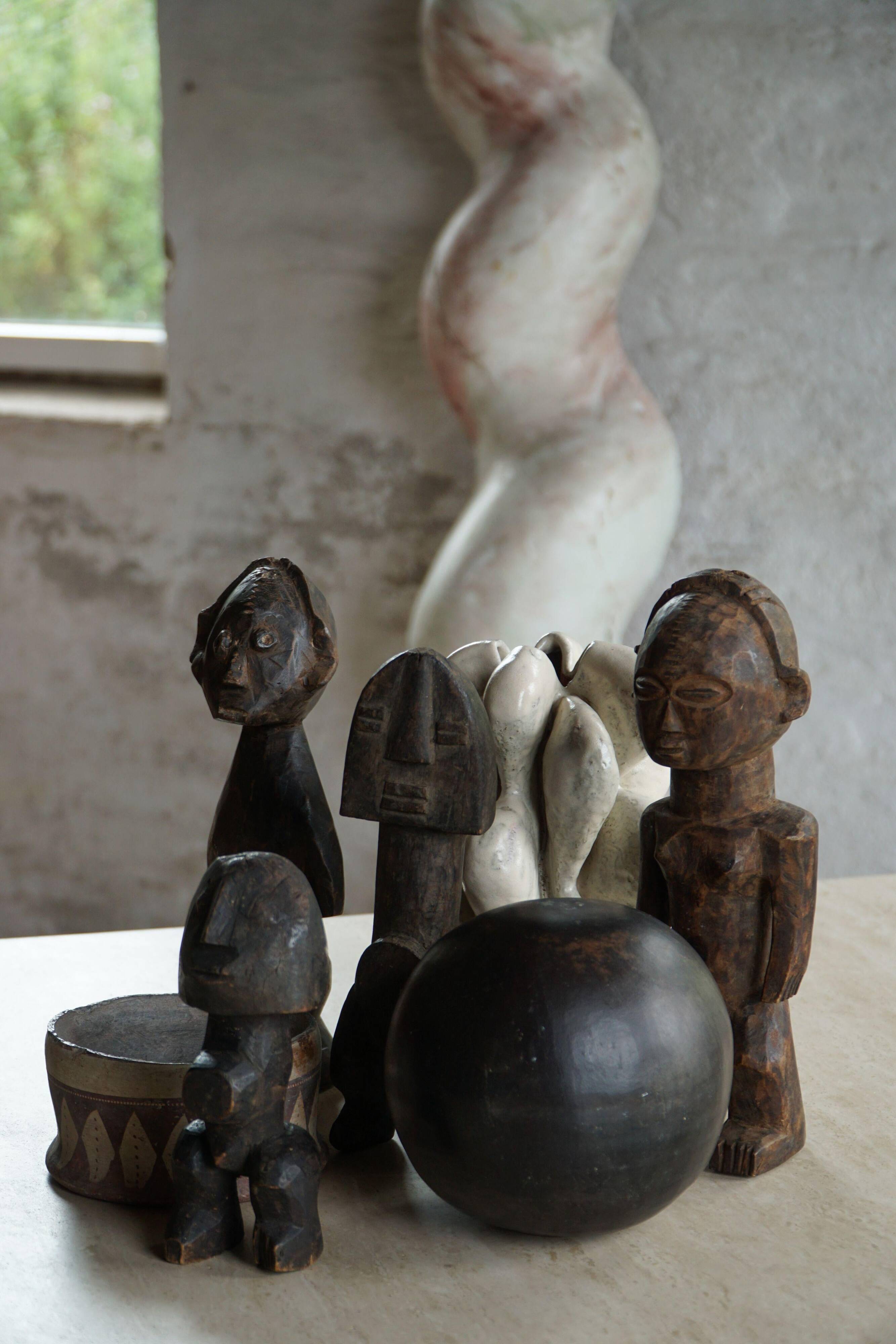 Set of 4 decorative handcrafted African wooden sculptures, mid-century.