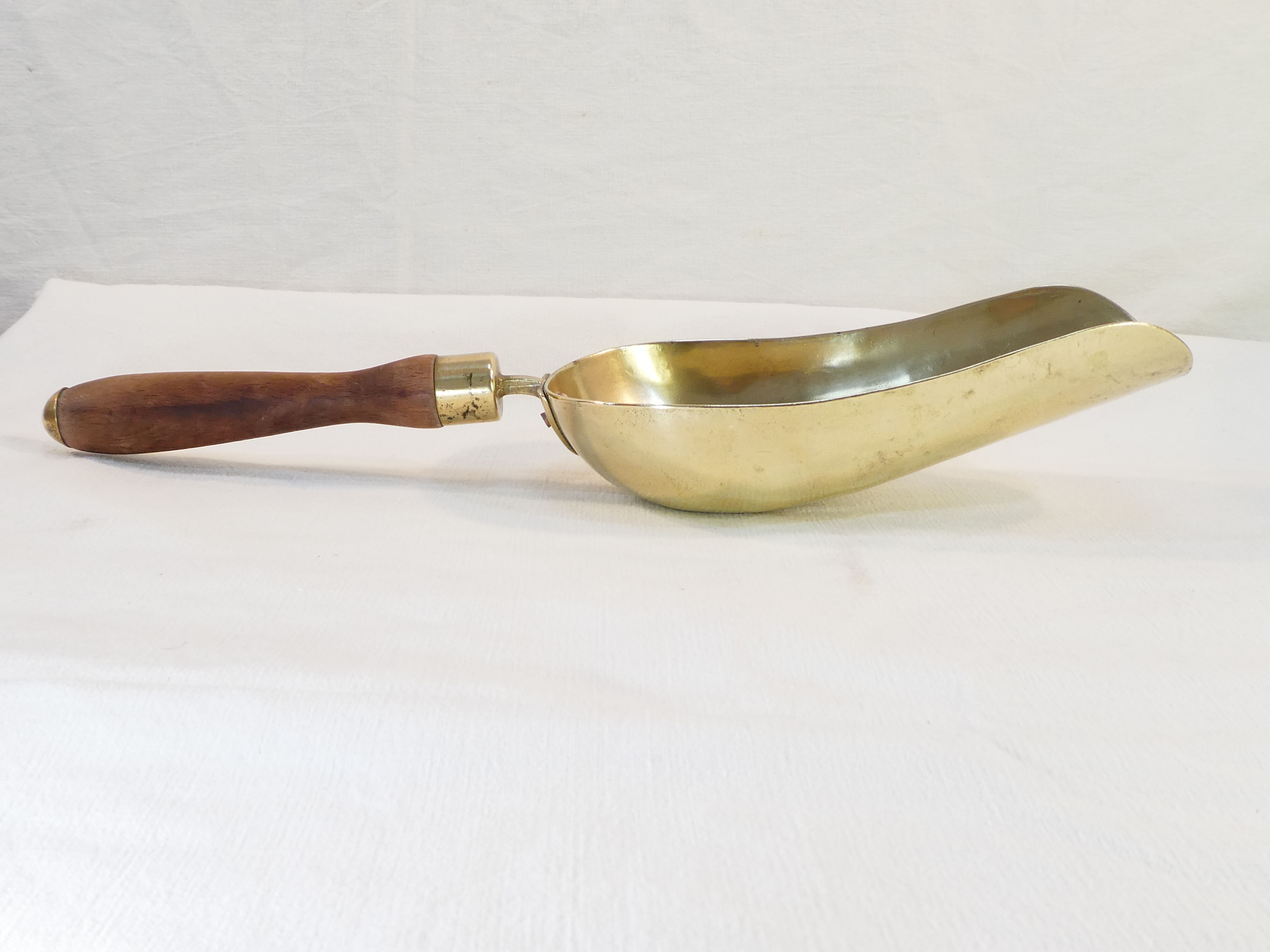 Old brass grocery grain shovel wooden handle