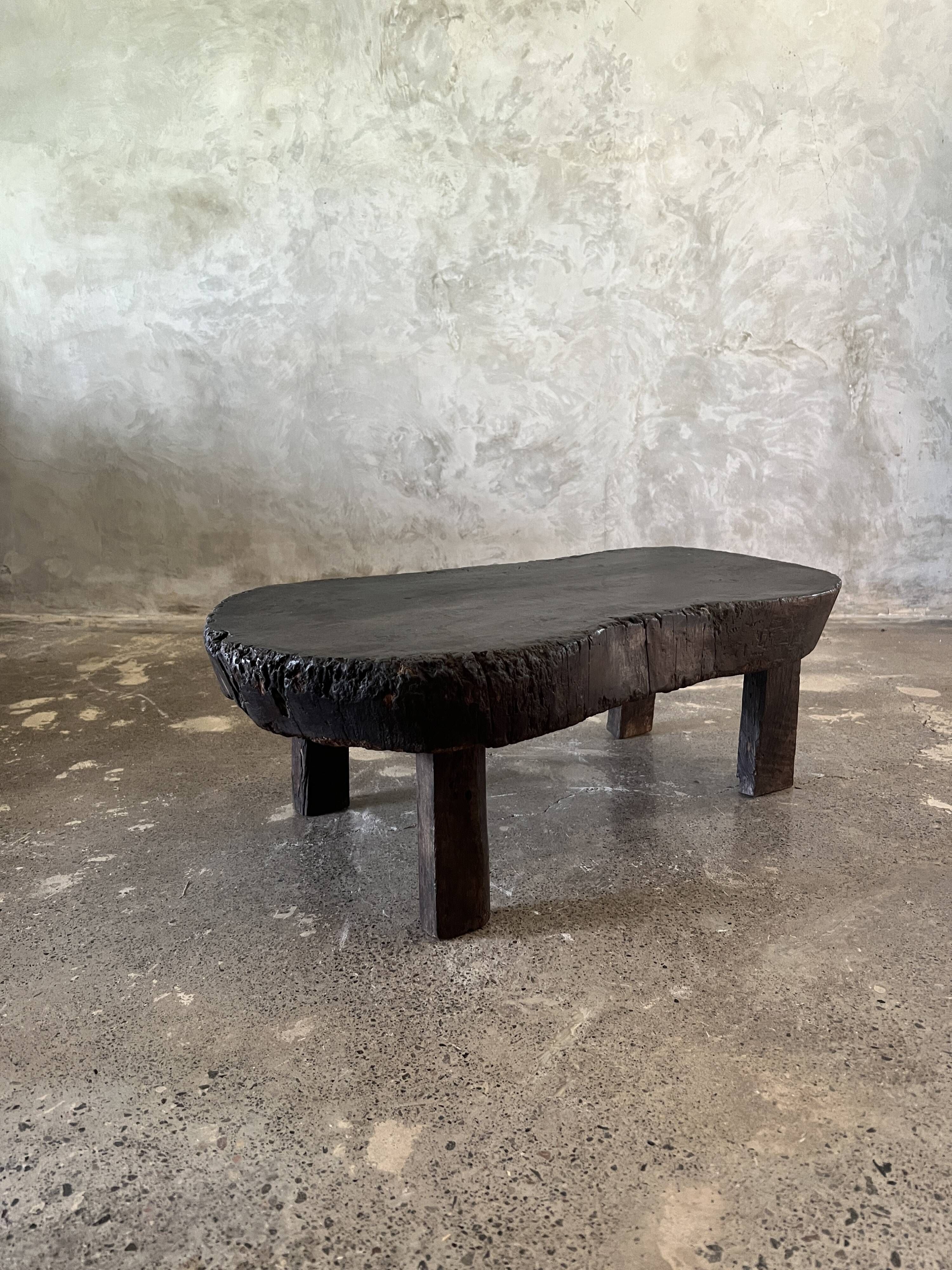 Small old Asian wooden coffee table in Japanese style, kidney-shaped top