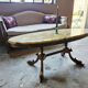 Oval coffee table in onyx and bronze – natural stone top – st