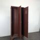 Red painted metal workshop locker with two doors.