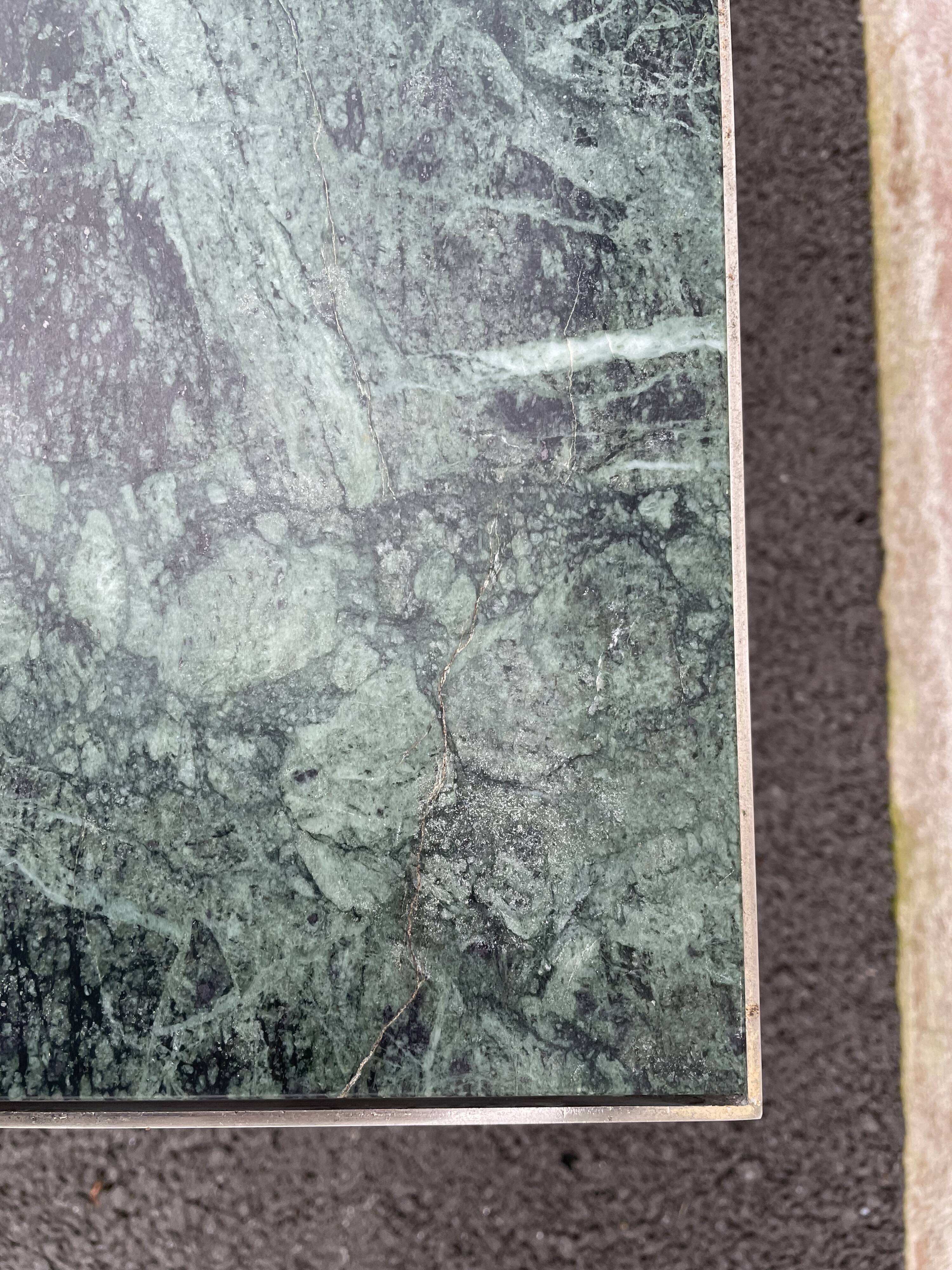 Coffee table in gilded brass and veined green marble