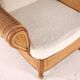 Large wicker armchair and its ottoman