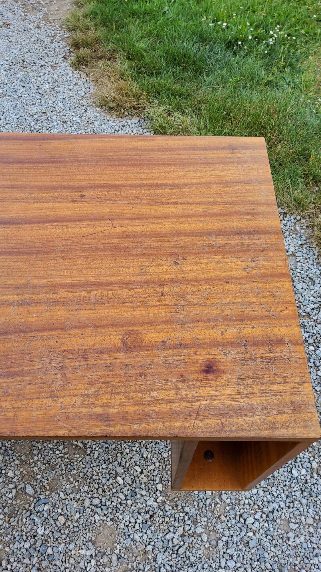 60s desk in golden blond mahogany with conical coffered feet