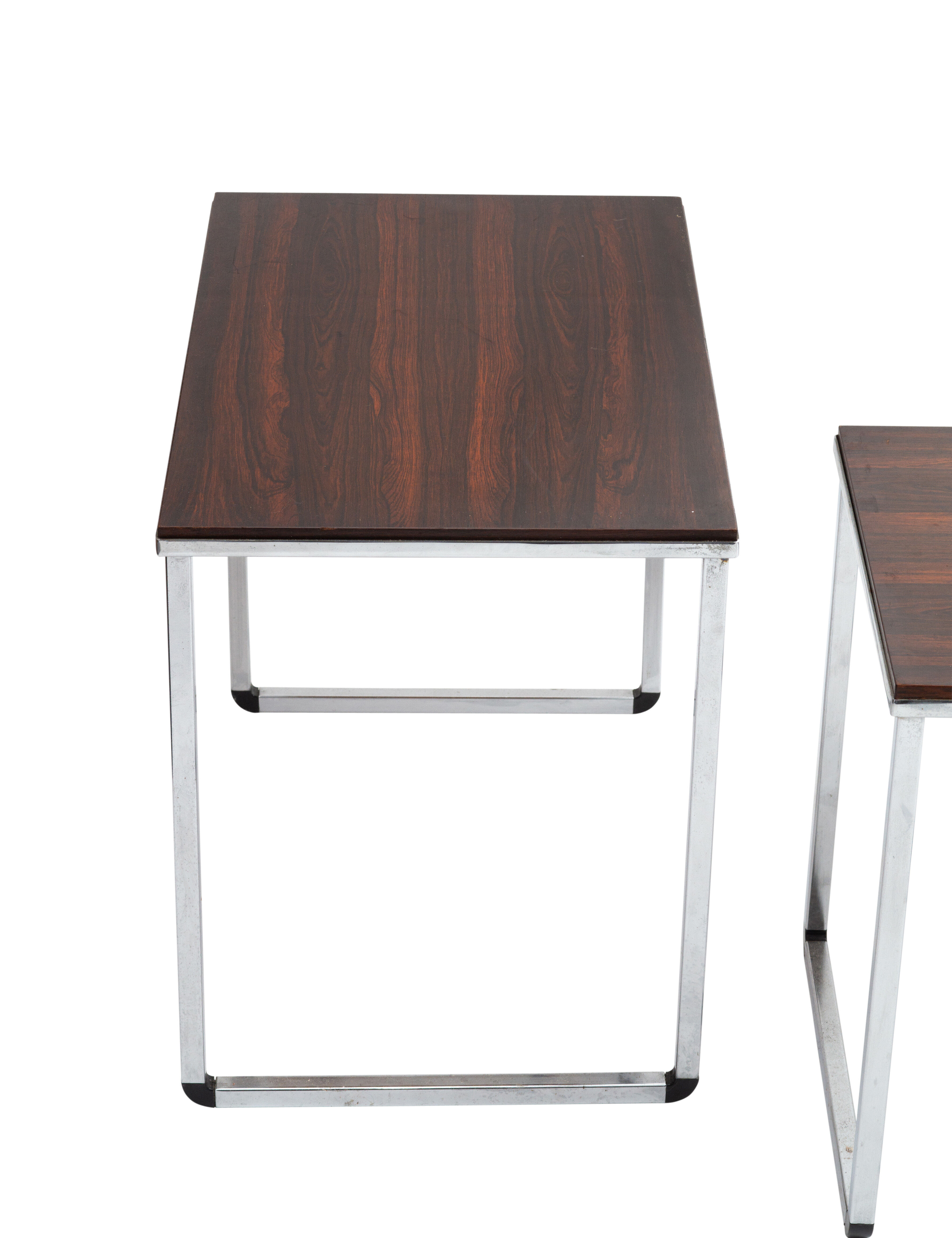 Vintage nesting table in rosewood and high polished metal base.