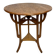 Round Art Nouveau coffee table with a sculpted top.