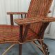 Sunbathing sunbathing in wicker rattan wood deckchair red lounger