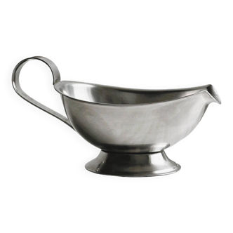 Stainless steel sauce boat with elegant handle and flared base.
