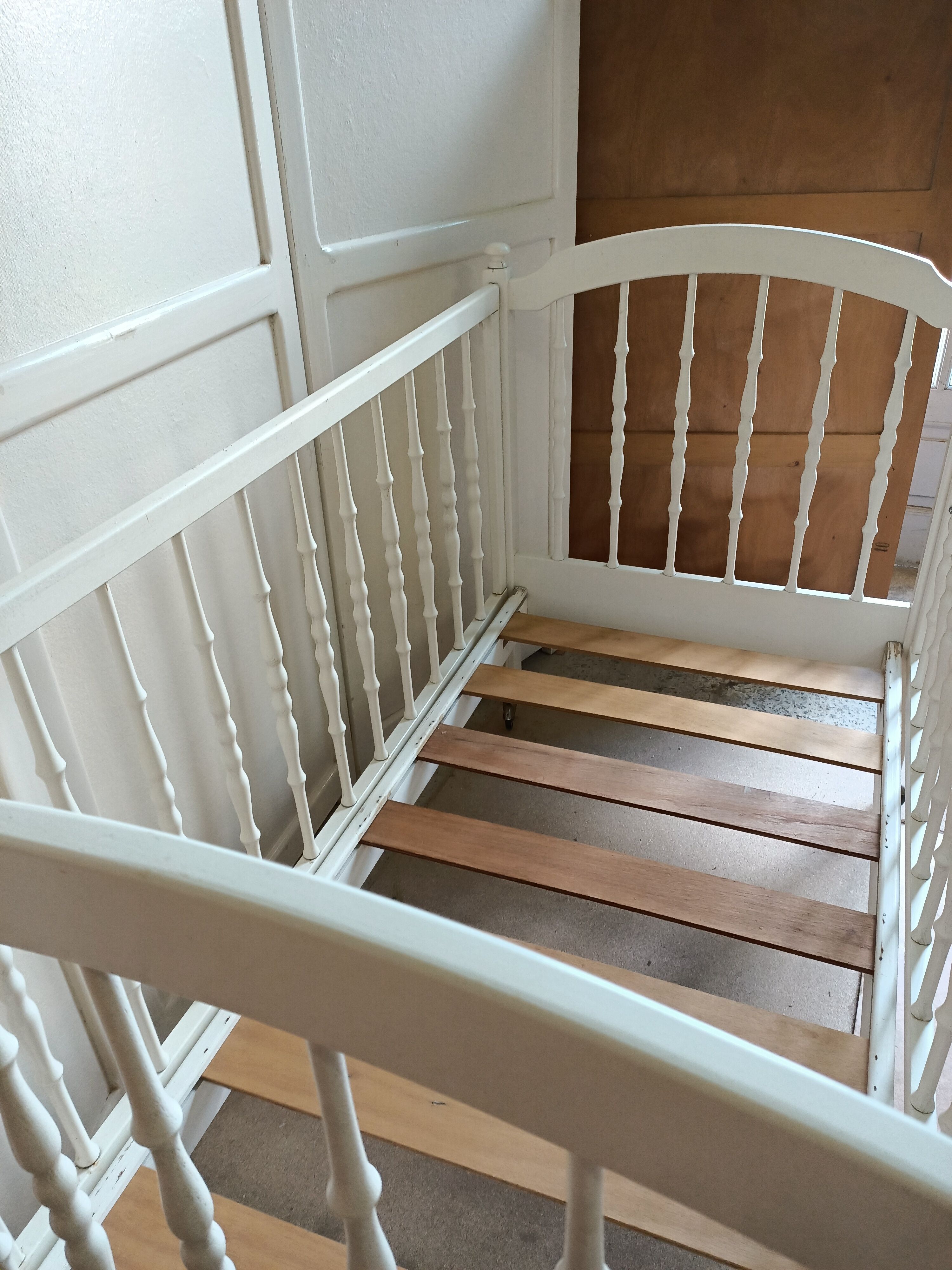 White-bar baby cot