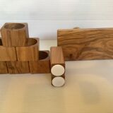 Six salt and pepper cherry-makers with their support