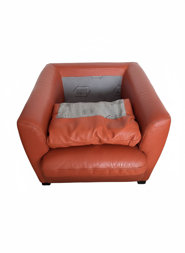 Roche Bobois armchair in mandarin colour.