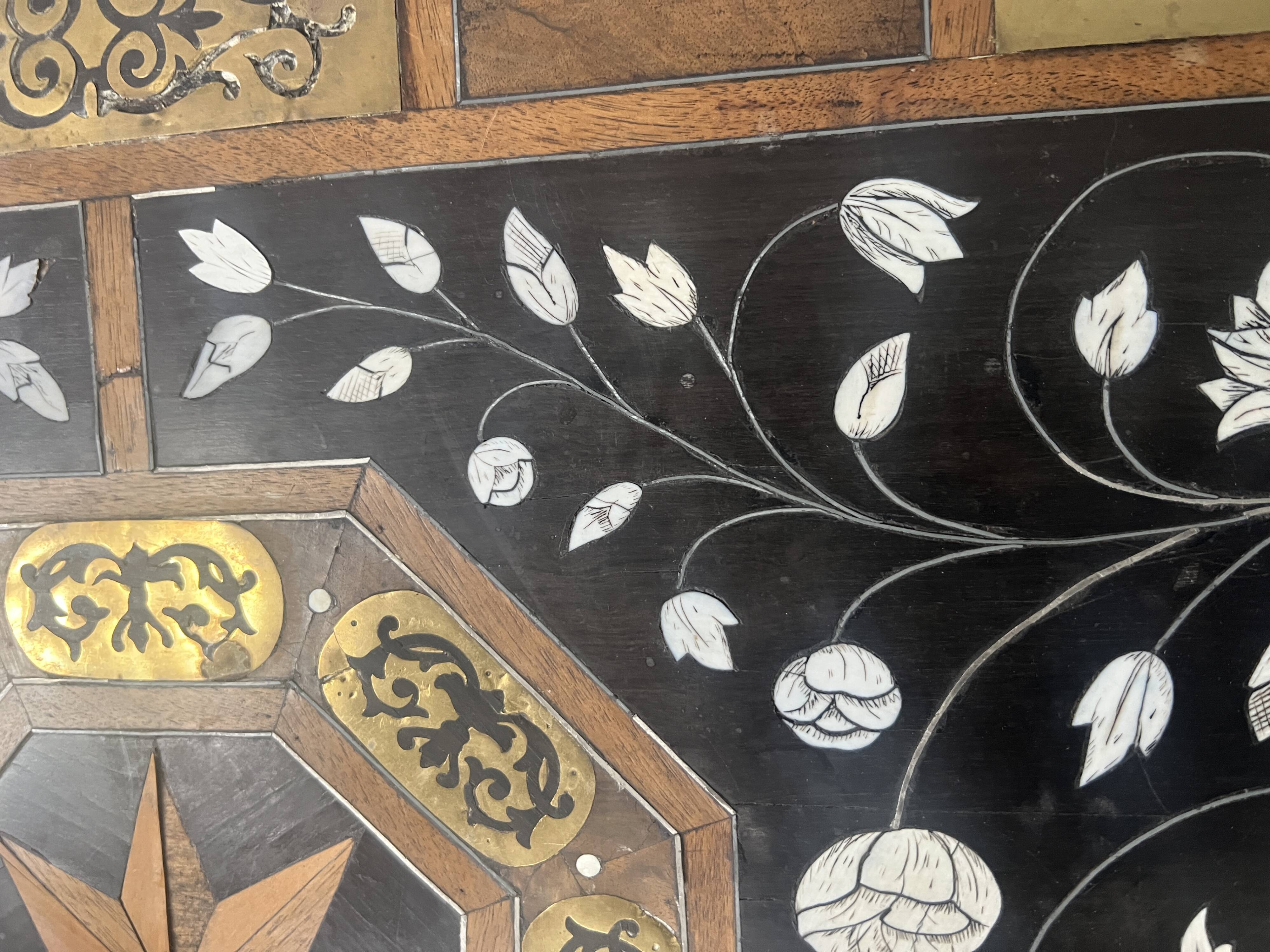 Blackened wood display table with marquetry top, Spain, 19th century.