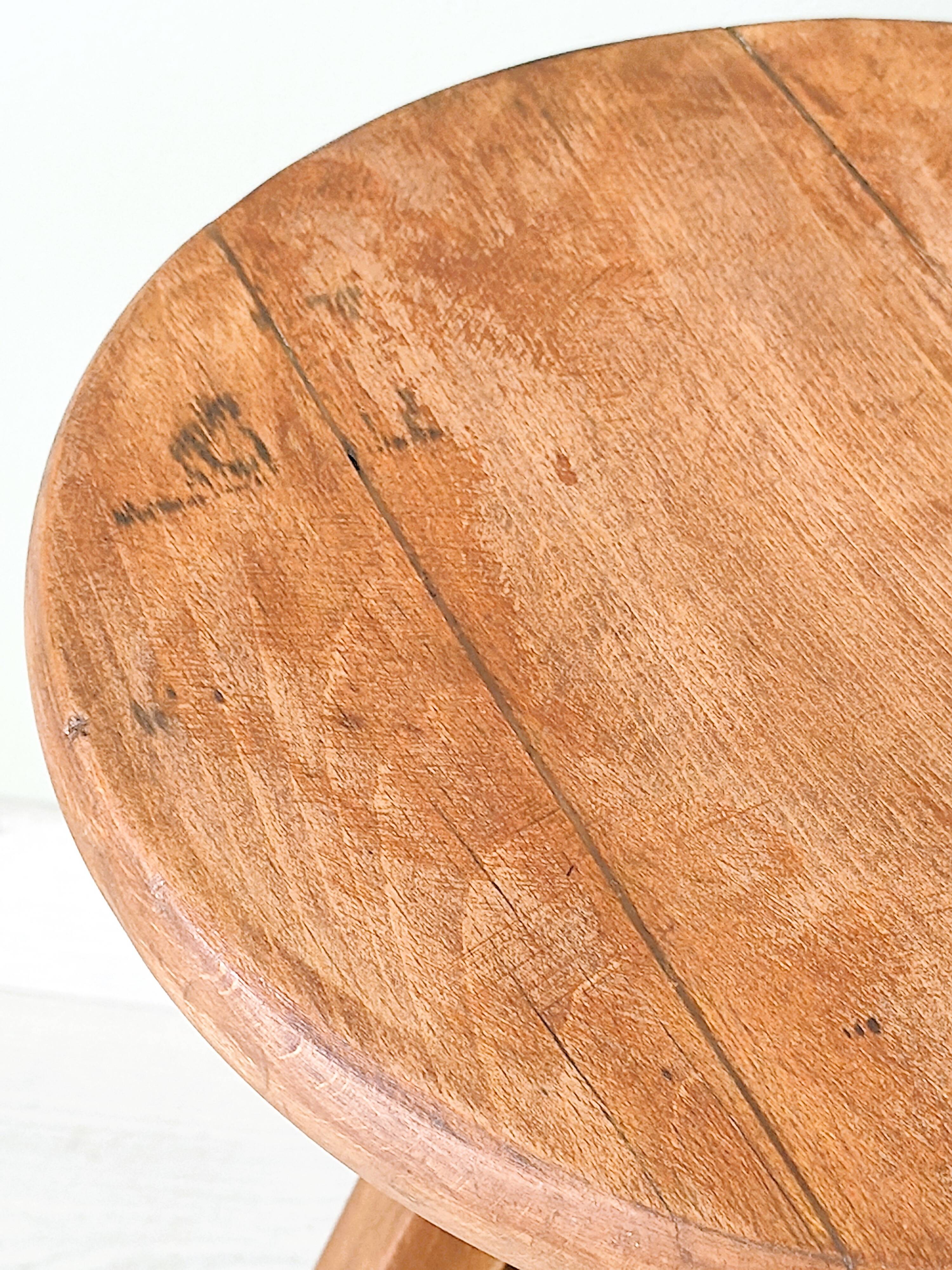 Adjustable vintage workshop stool made of solid wood