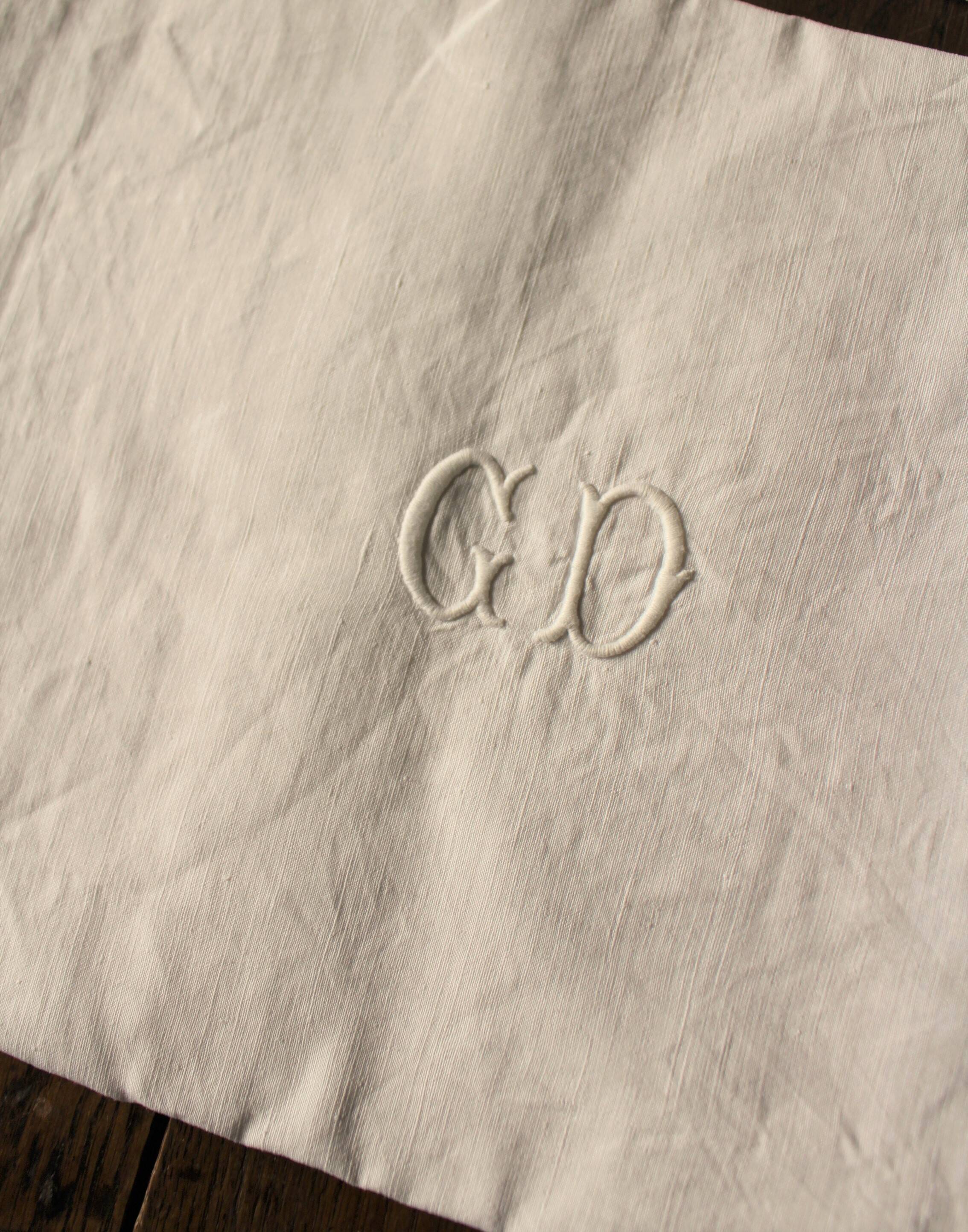 Un Lot de 2 serviettes de table lin blanc monogrammes G D