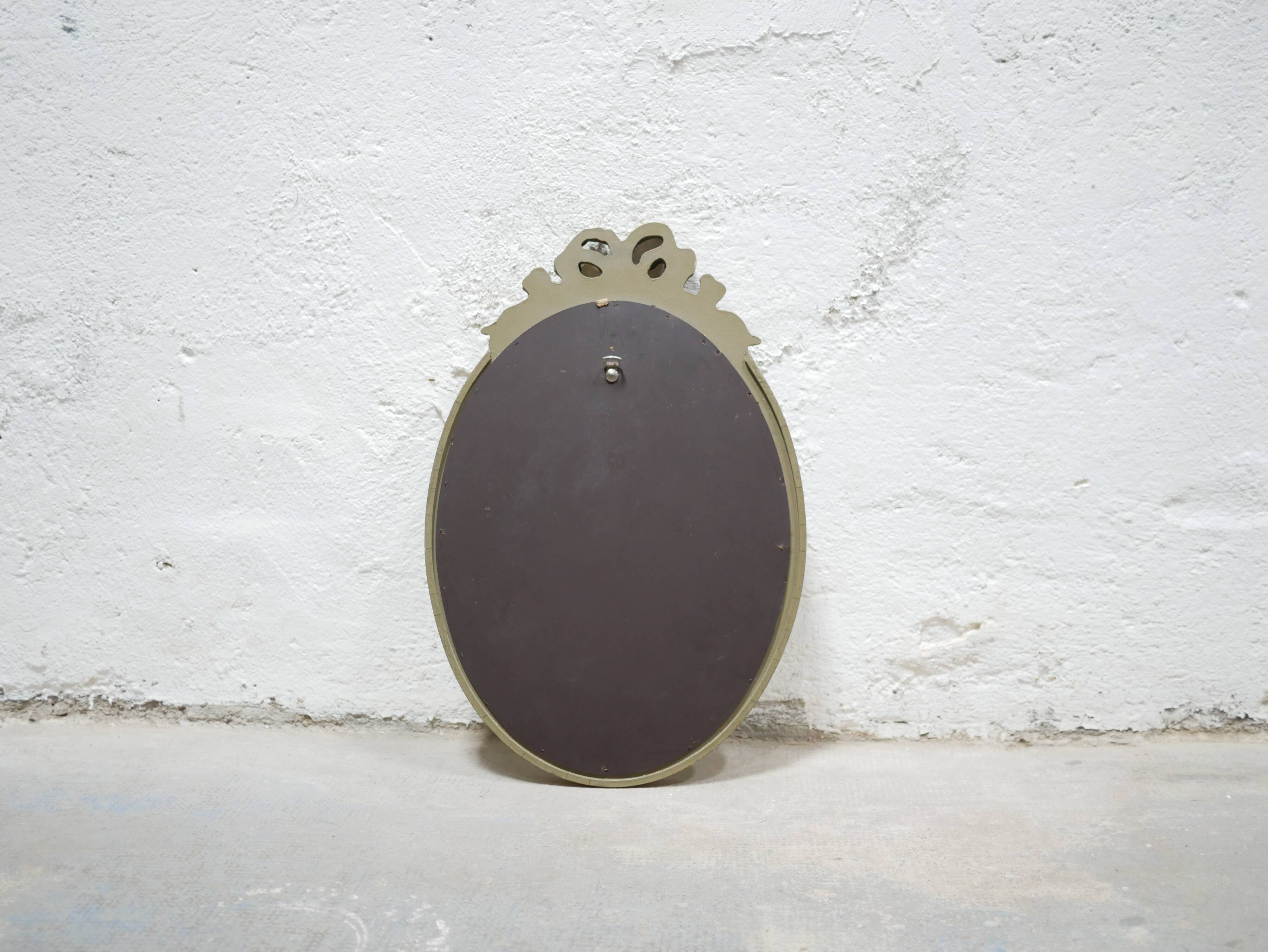 Old oval mirror Louis XVI style in gilded wood 50cm x 34cm