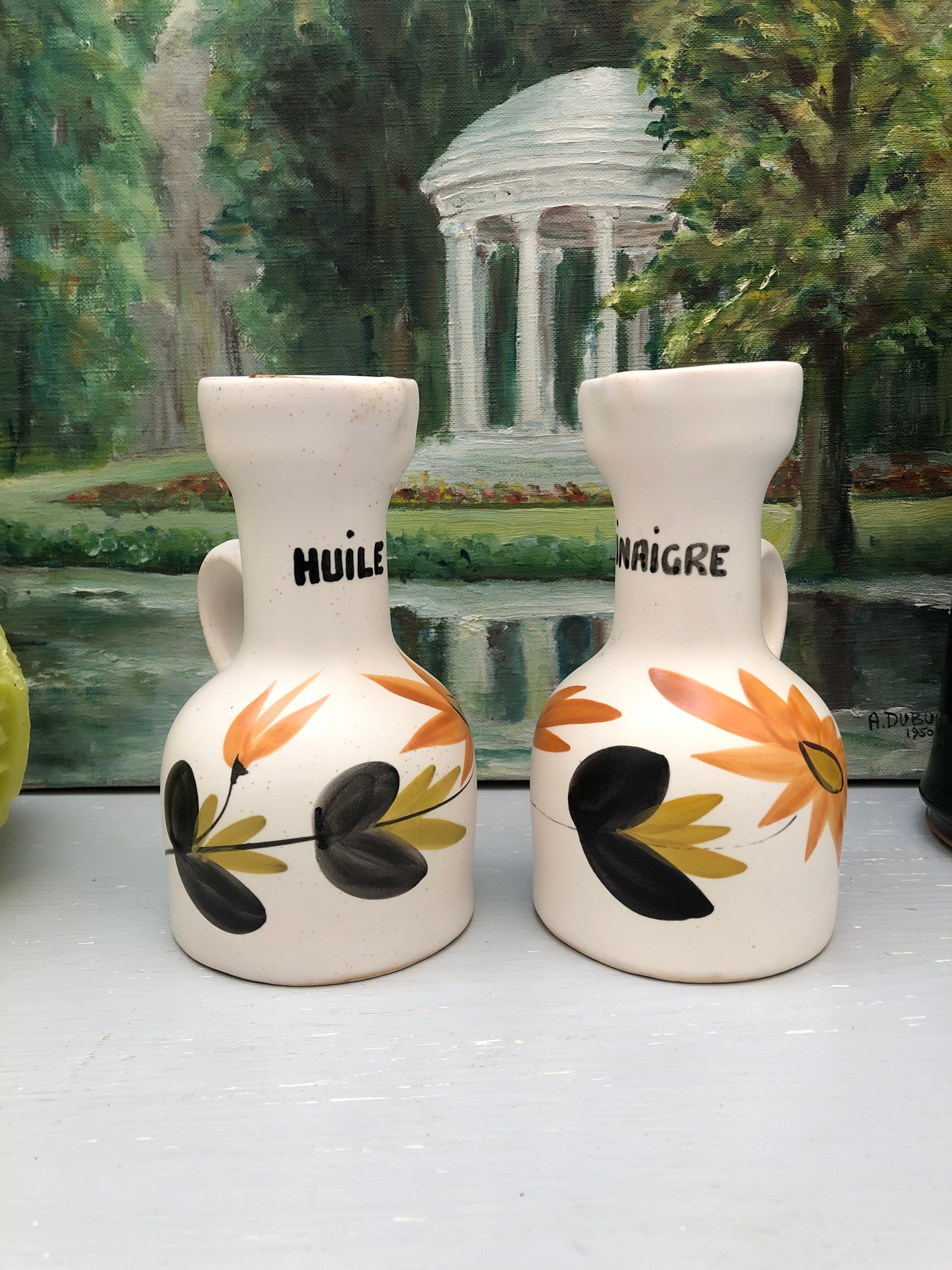 Old vinegar and oil maker with vintage decoration floral motifs