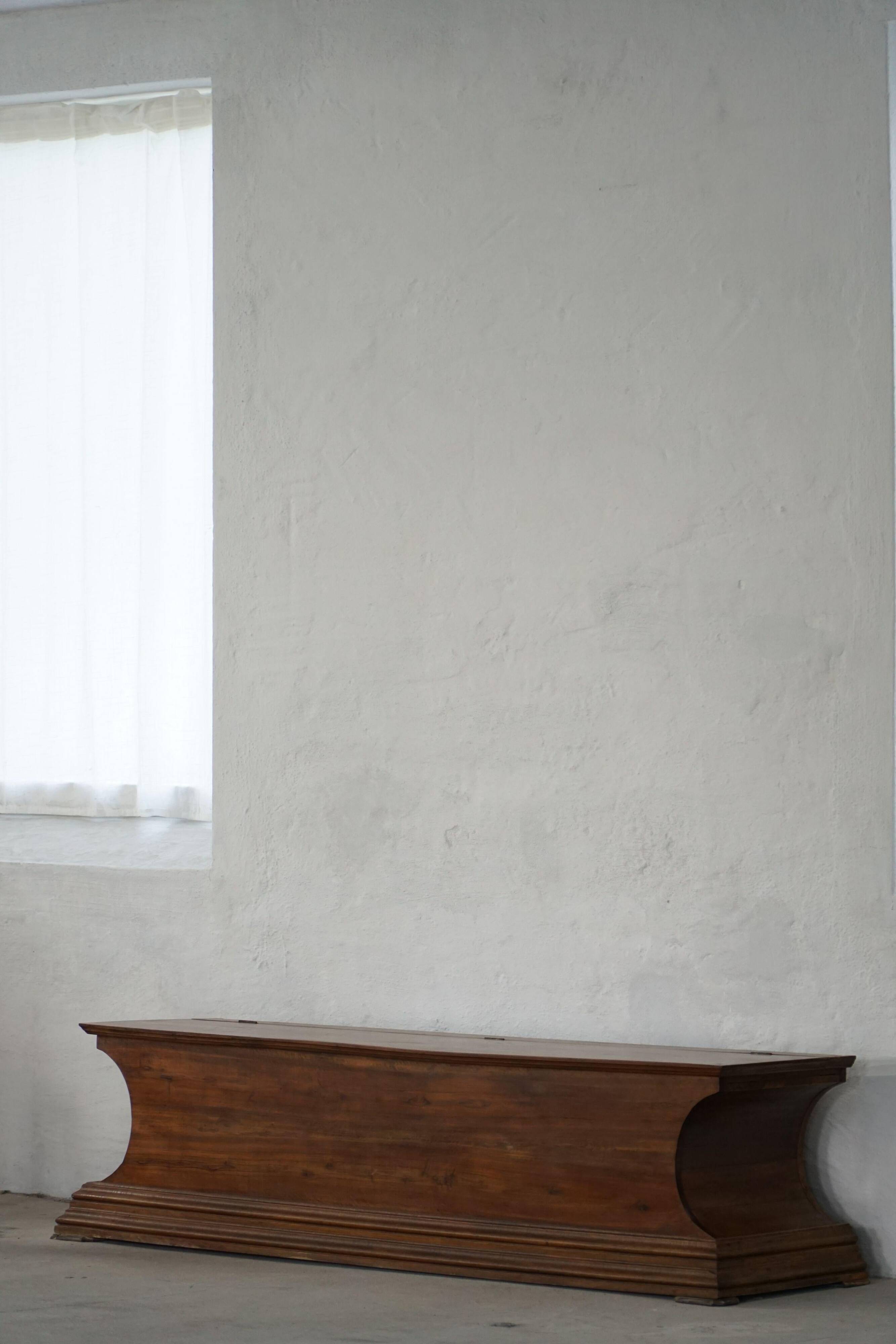 20th-century Art Deco storage bench in walnut, by a Danish cabinetmaker.