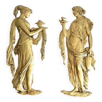 Pair of female bas-reliefs in gilded bronze