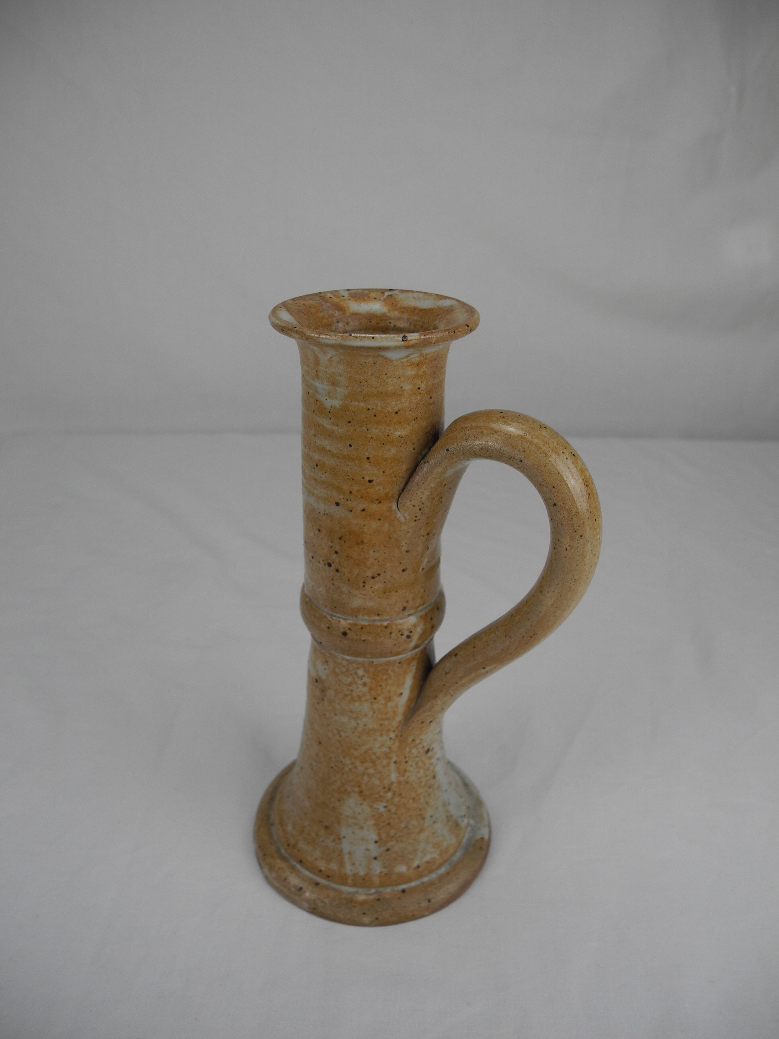 Old vintage stoneware candle holder
