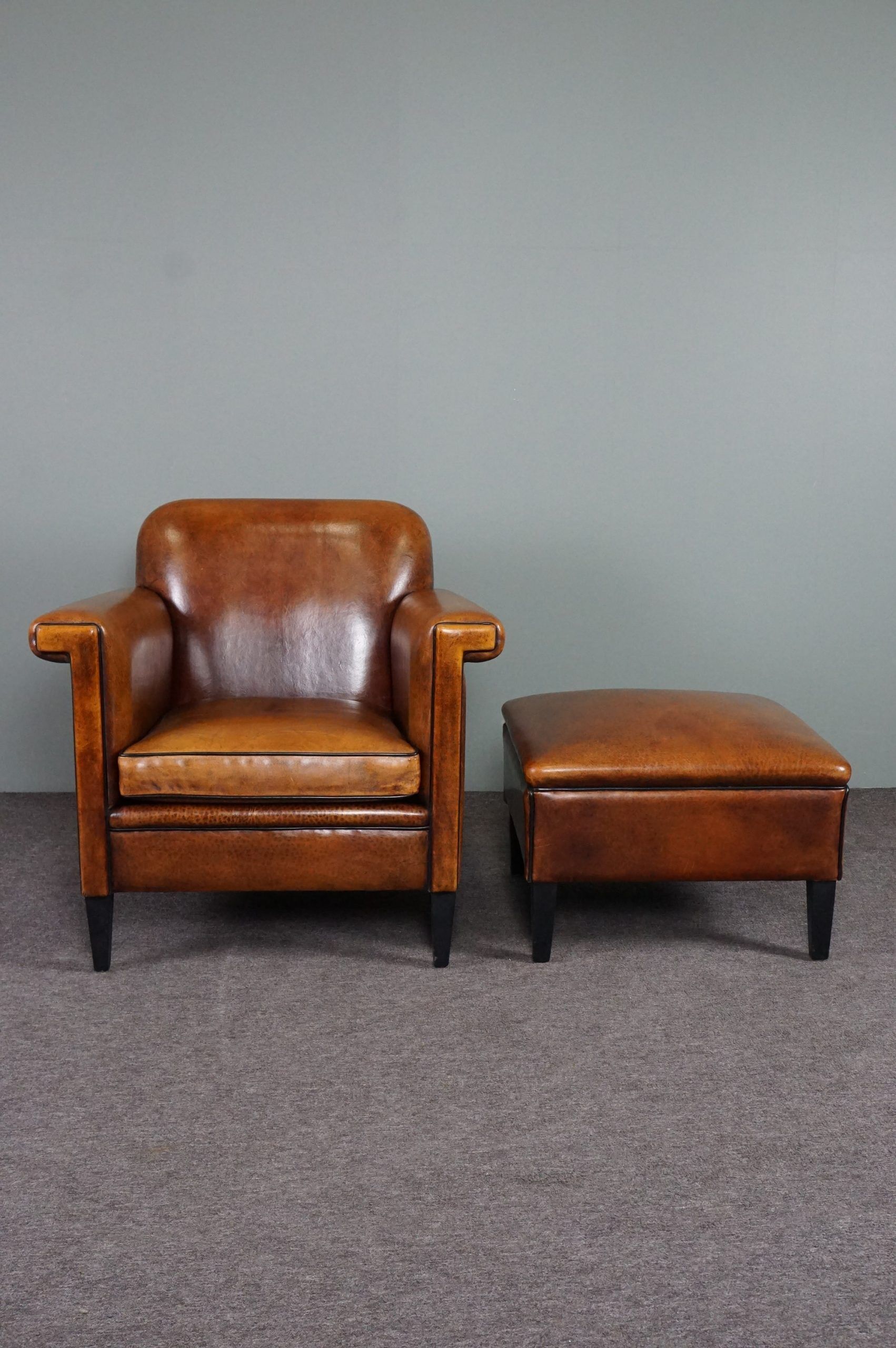Schapenleren armchair and studio lounge stool