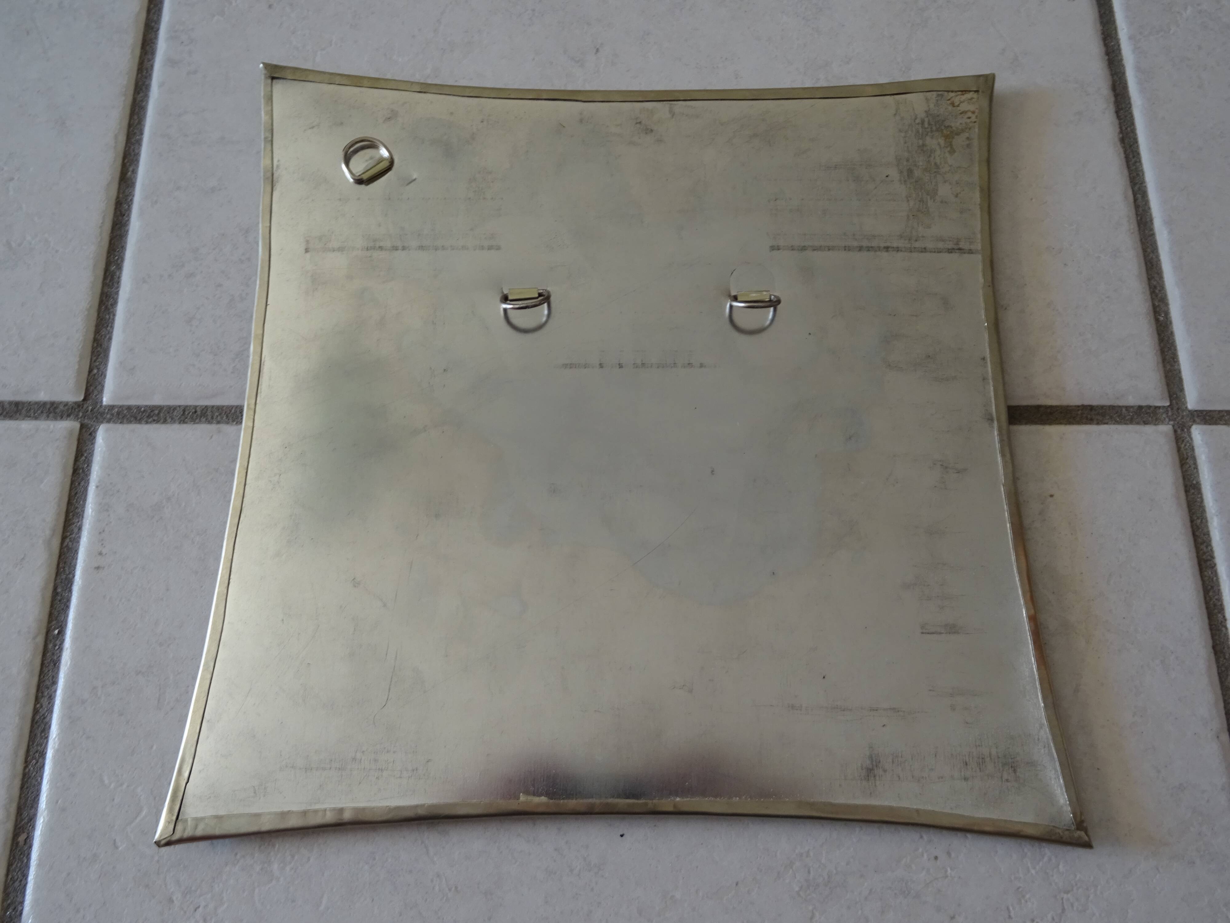 Hammered metal mirror design