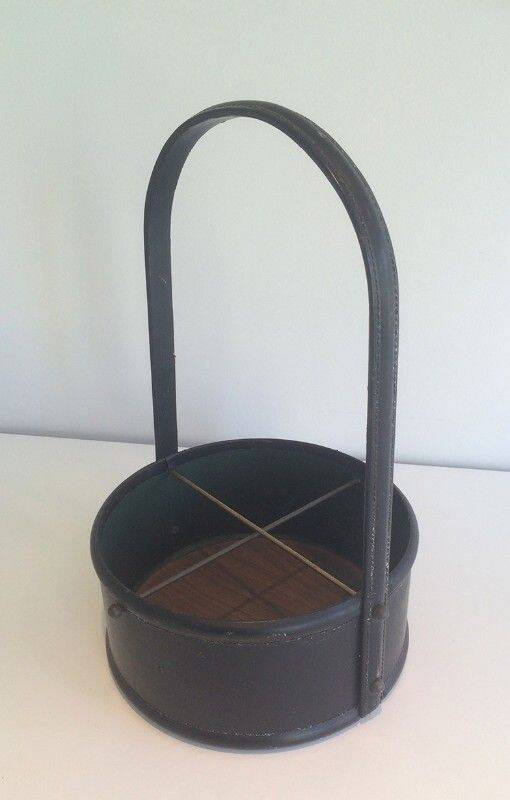 Leather wall magazine rack. In the style of Jacques Adnet.