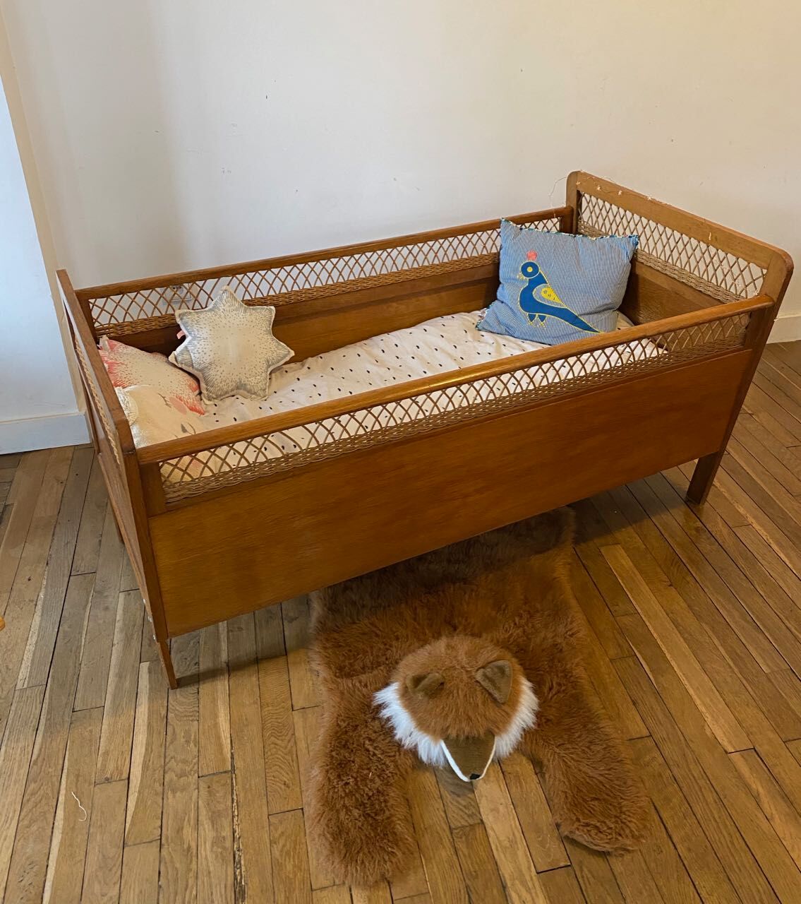 Wooden and wicker baby bed