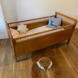 Wooden and wicker baby bed