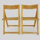 Pair of vintage folding chairs in beech and canework. Italy 70s