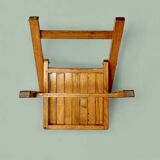 Old varnished wooden folding chair for children