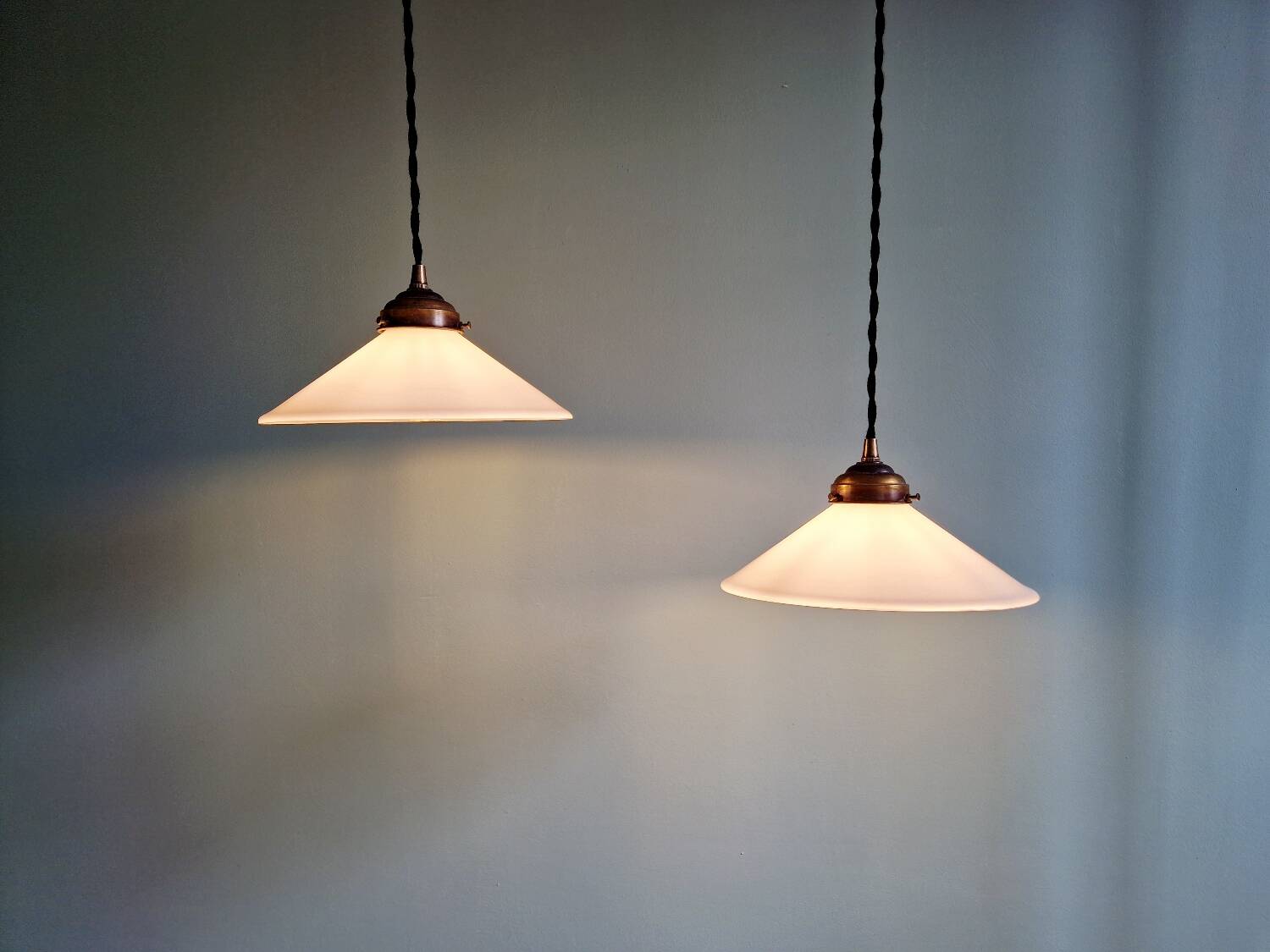 Pair of Art Deco conical white opaline pendants, 1920-30.