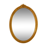 Antique oval-shaped gilded mirror