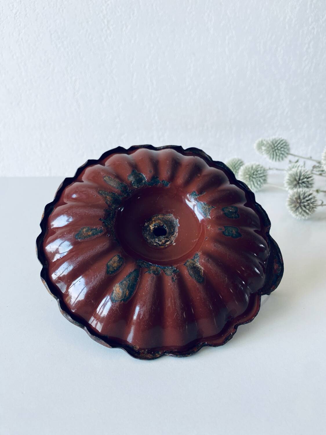 Antique enamelled candle holder