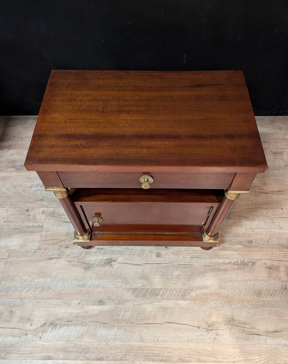 Pair of Empire style bedside tables in mahogany and gilded bronze