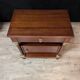 Pair of Empire style bedside tables in mahogany and gilded bronze