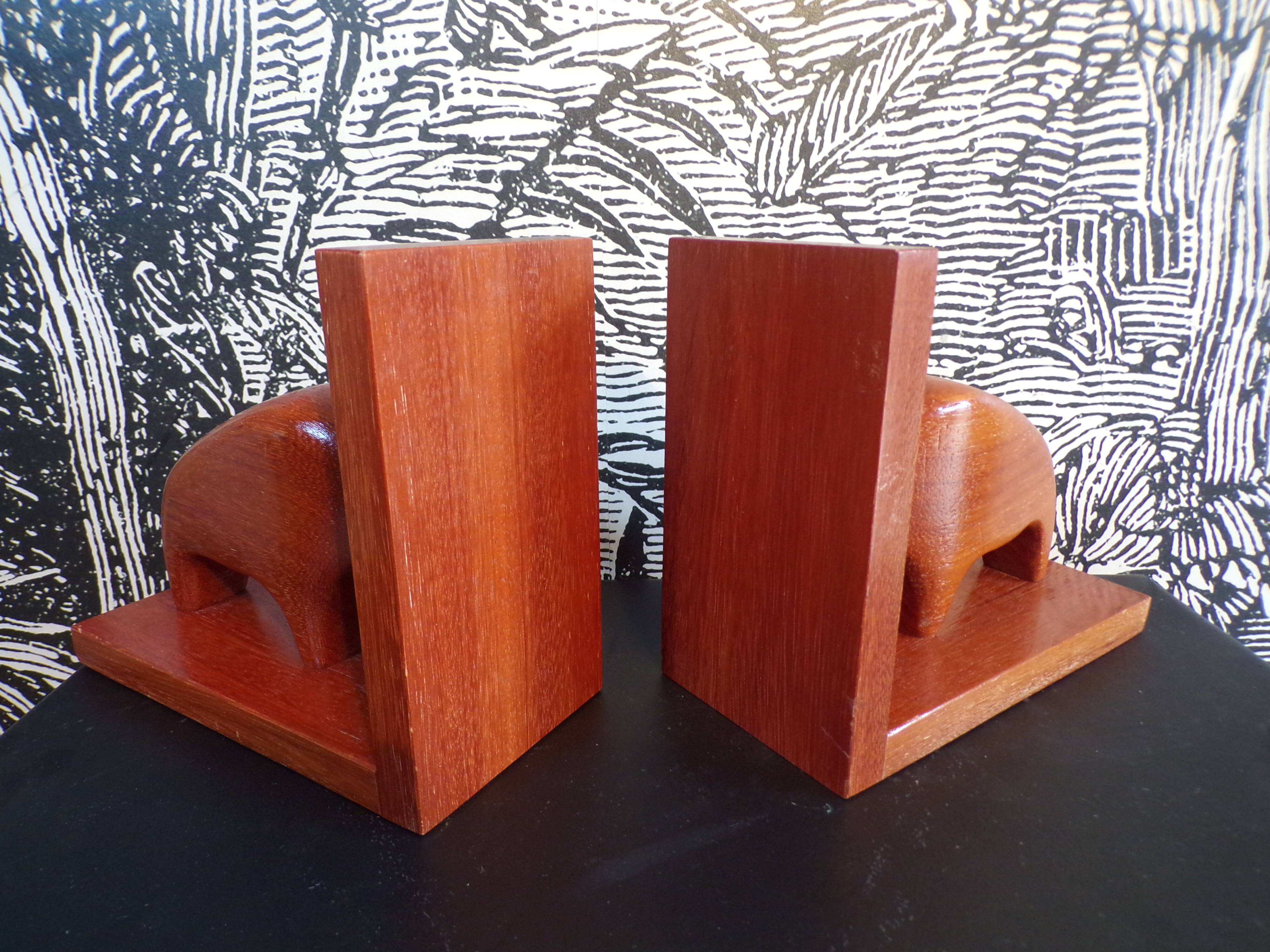 Pair of teak bookends in the shape of a bison