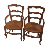 Paire de fauteuils paillés