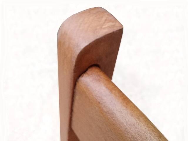 Vintage chairs from the 1950s in wood and faux leather.