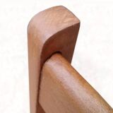 Vintage chairs from the 1950s in wood and faux leather.