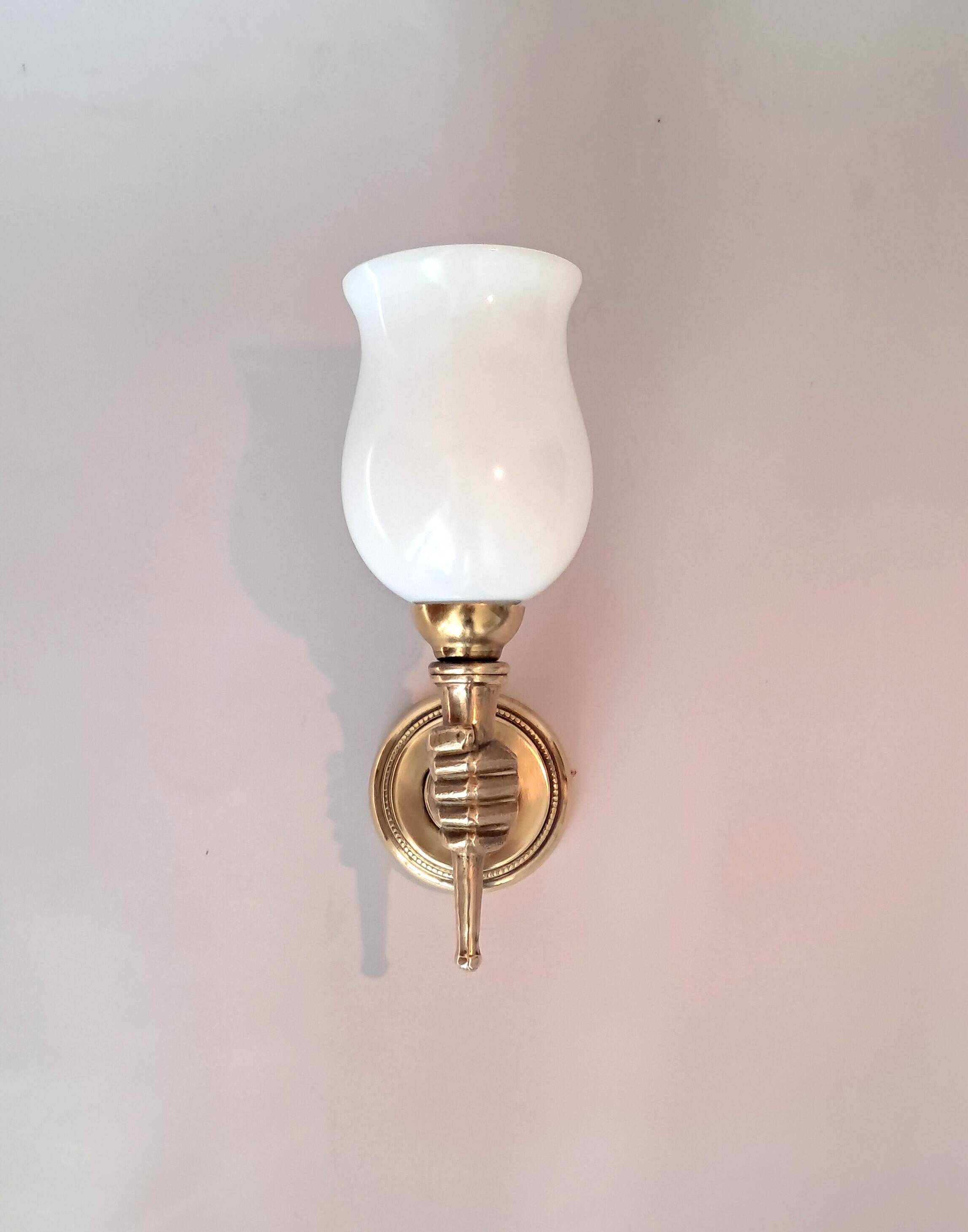 Golden brass wall light from the 1950s.