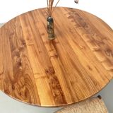 Modernist round table in solid elm, crossed legs.