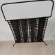 “Santiago” magazine rack in perforated sheet metal Mathieu Mategot 1950s
