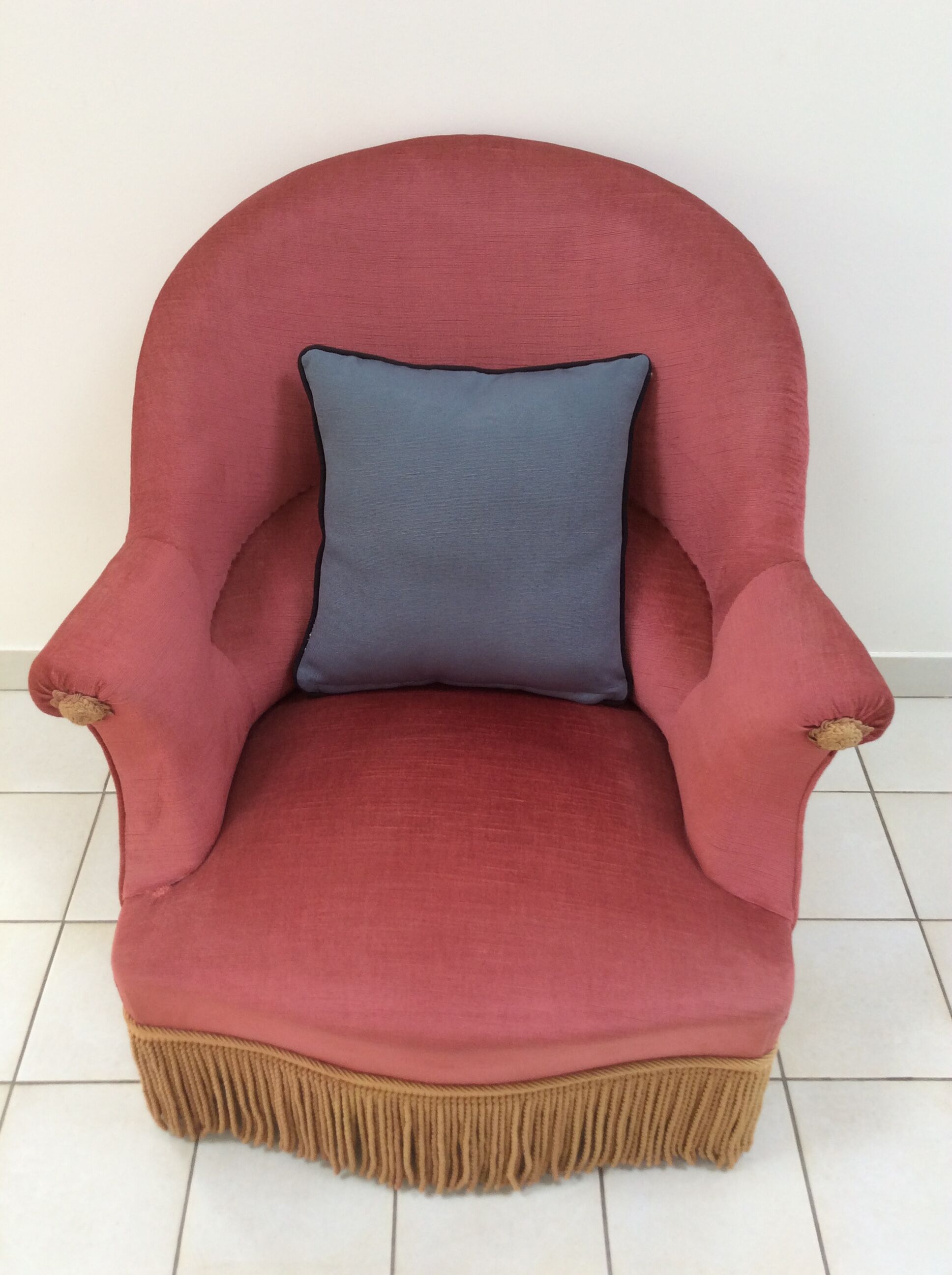 Toad in powder pink velvet armchair