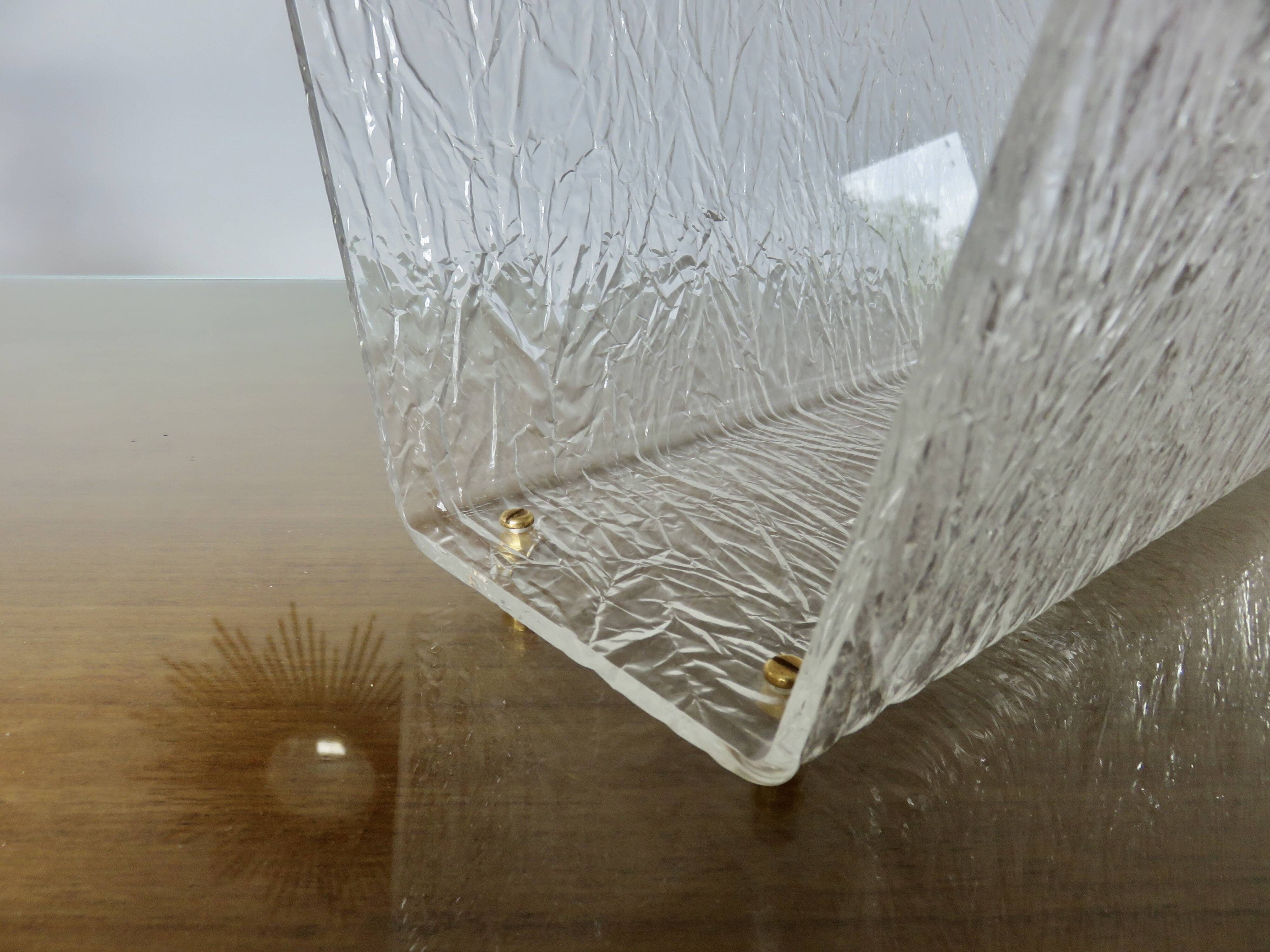 "Roche Bobois" magazine rack in lucite, plexiglass, altuglas and brass, 1970