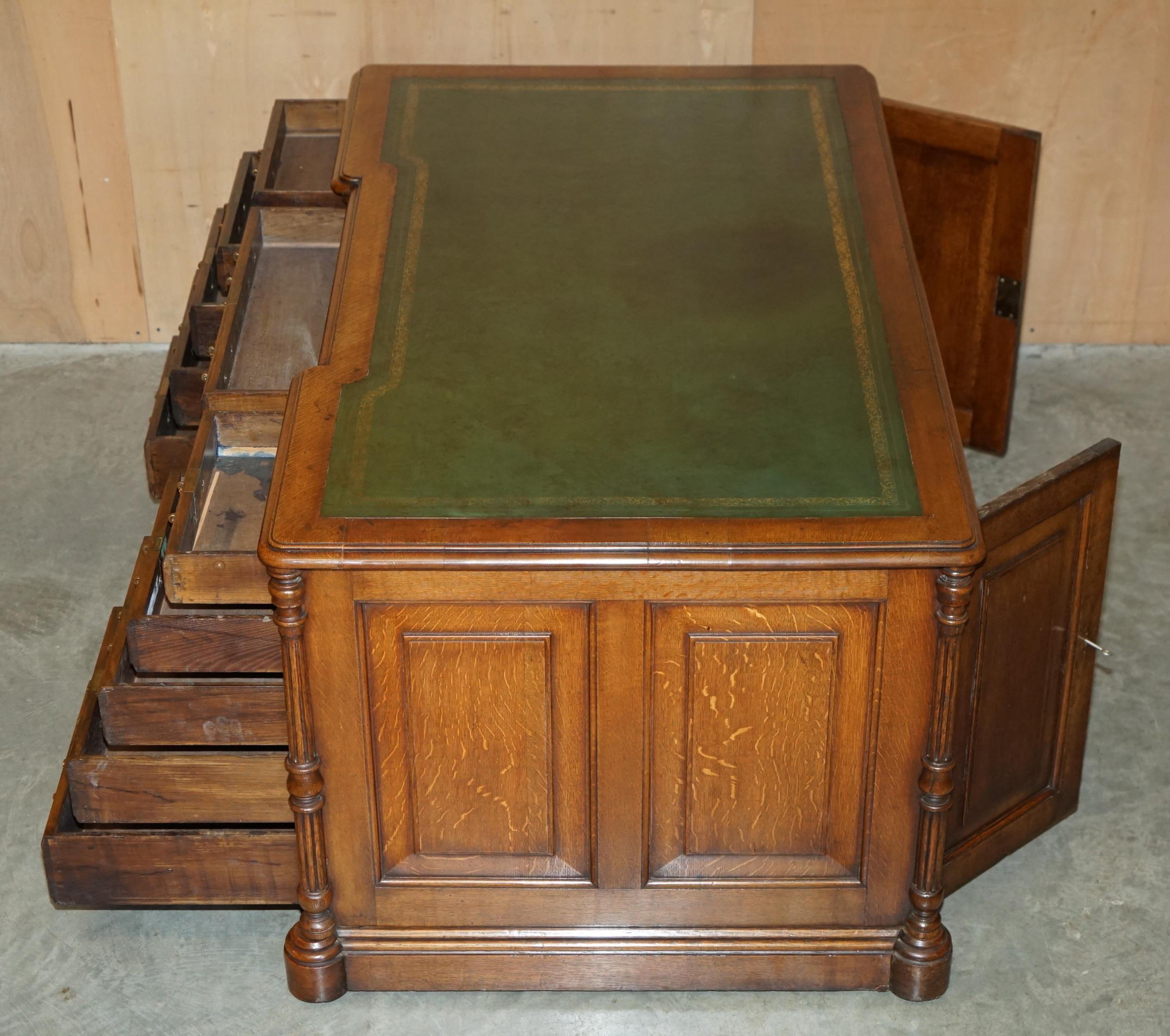 Antique double-sided desk C Hindley & Son in oak and leather