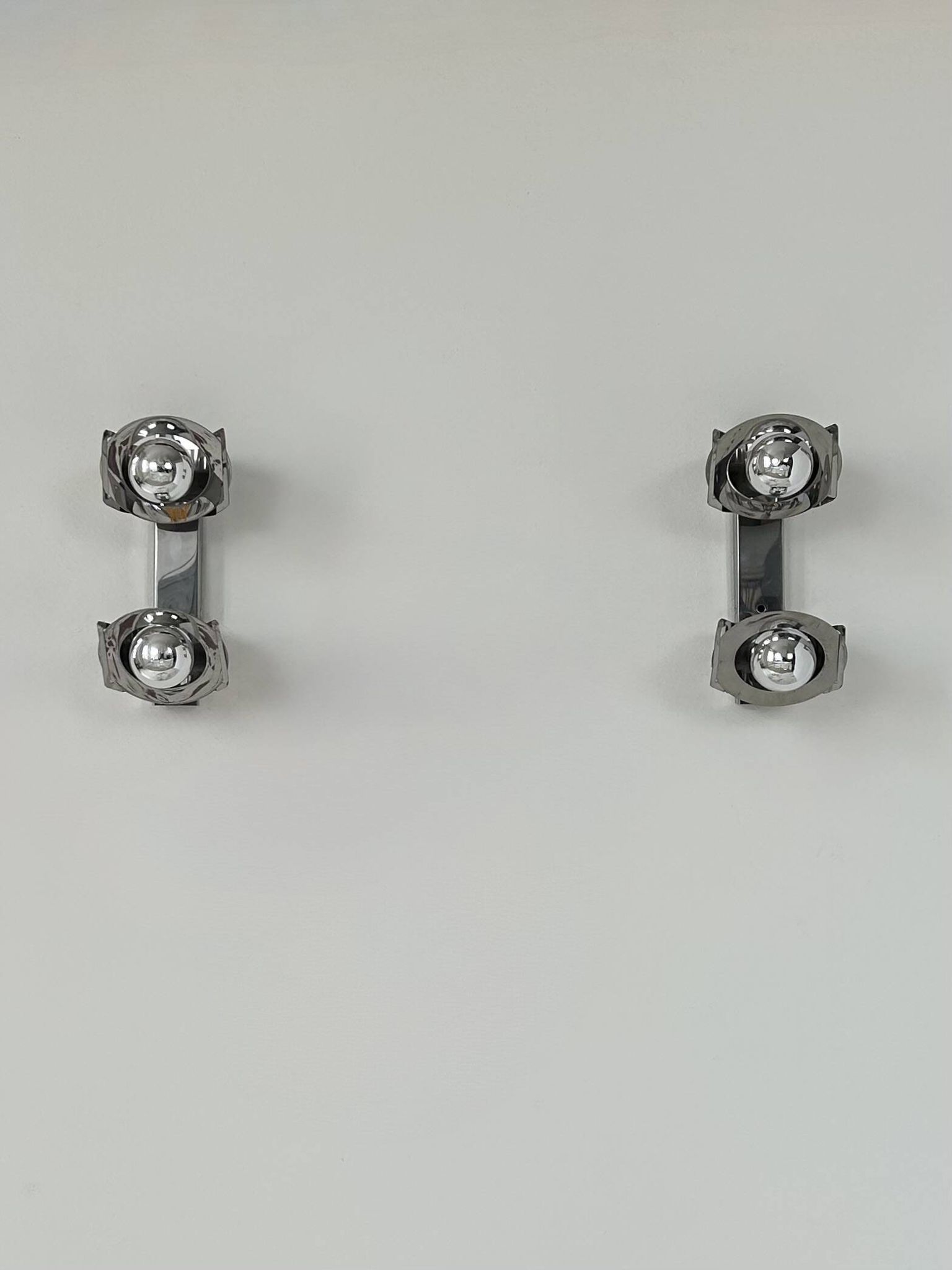 Pair of vintage wall lights, chrome metal, France, 1970.