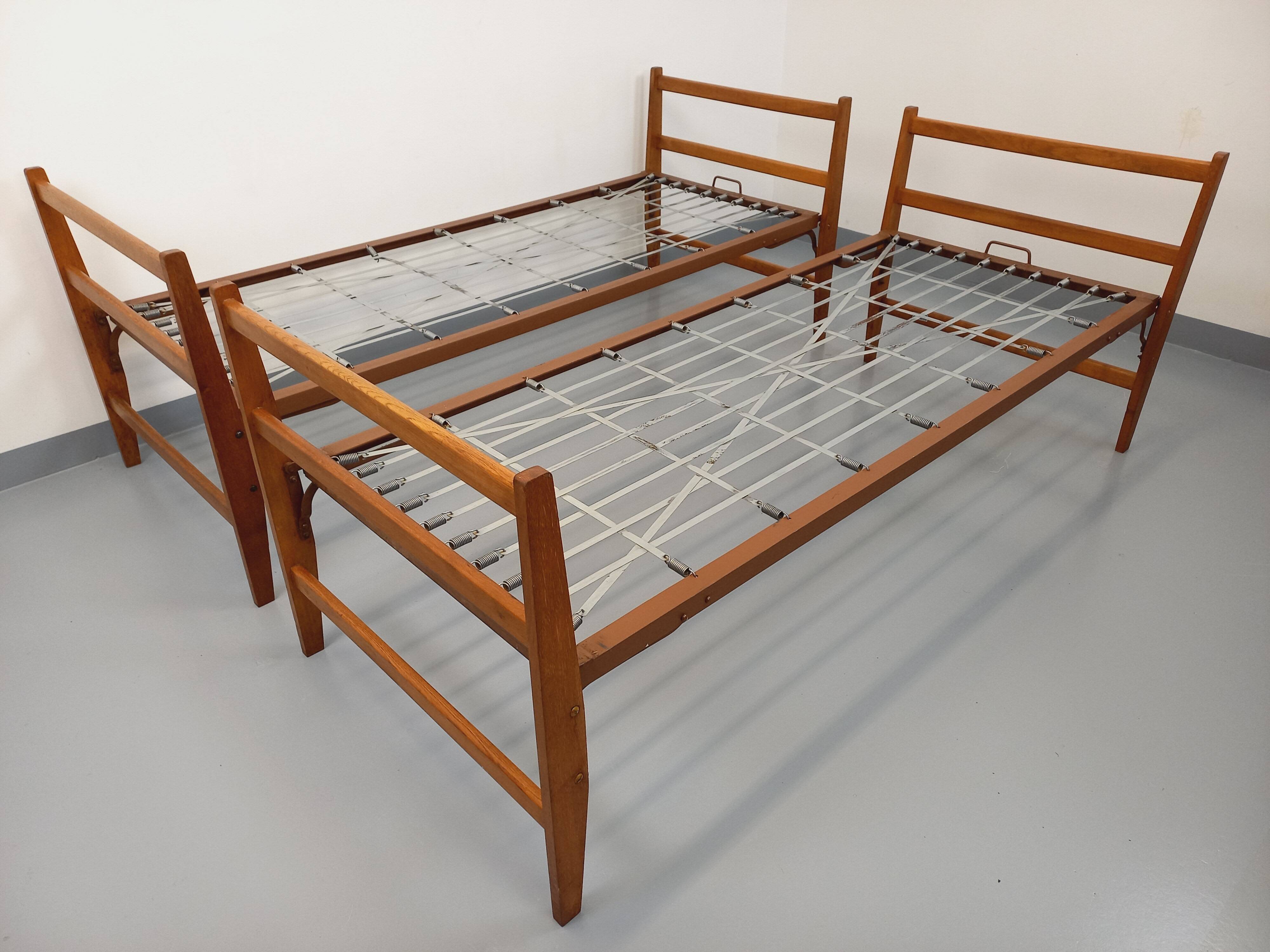Pair of vintage stackable daybeds in oak wood and metal from the 60s