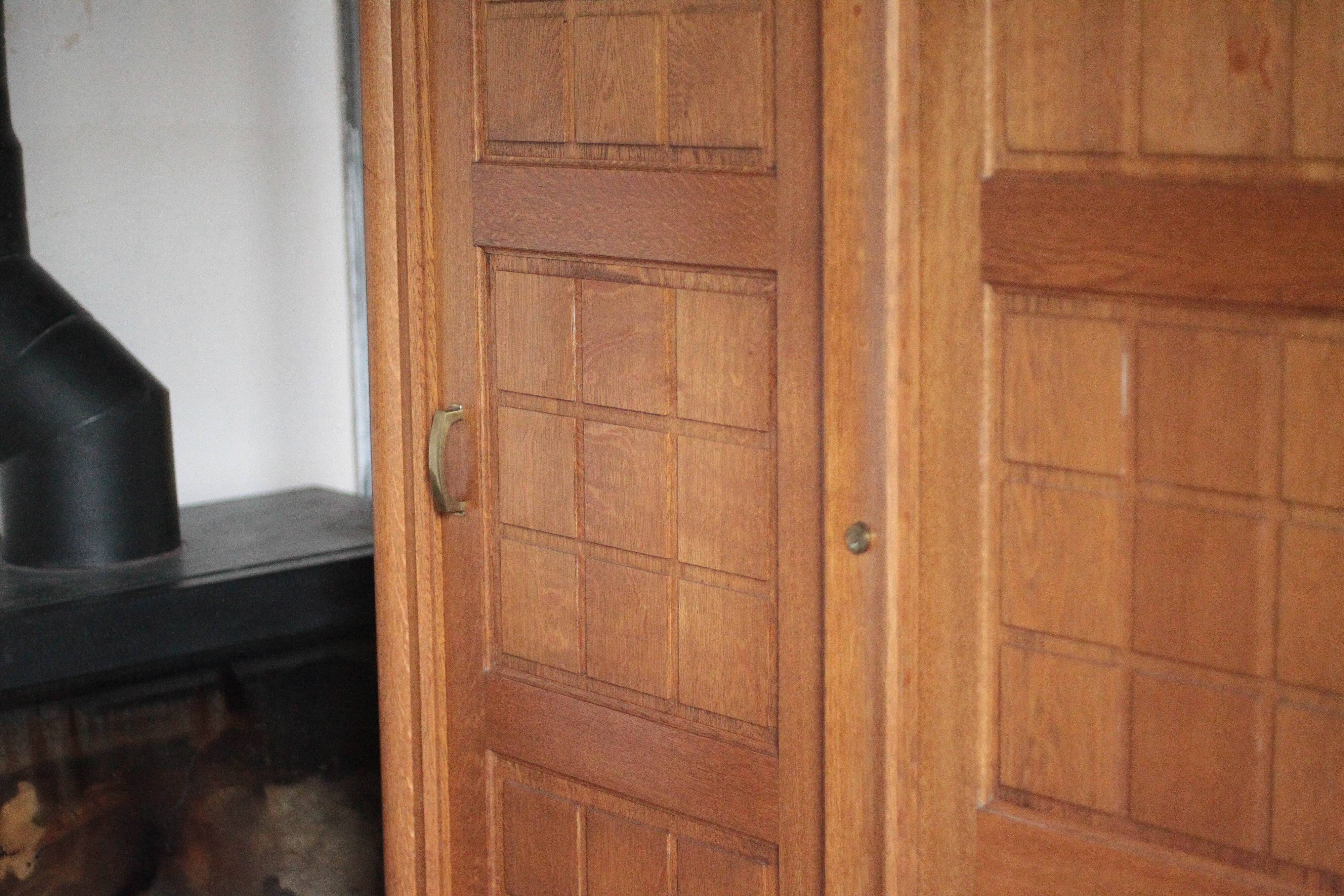 Vintage wooden wardrobe with sliding doors.