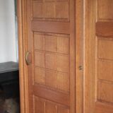 Vintage wooden wardrobe with sliding doors.